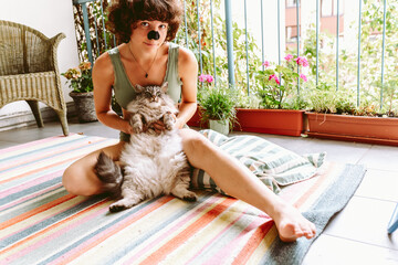 Yoga on balcony with pet cat