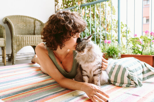 Yoga on balcony with pet cat