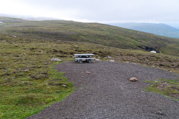 Roadside rest area in Iceland, with a picnic table, on a hill