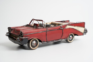 vintage tin toy American car  on an isolated white background