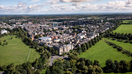 Aerial townscape view of Harrogate with traffic and The Stray public park