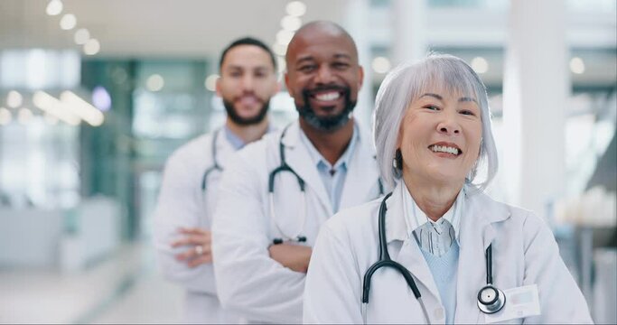 Crossed arms, team and face of doctors standing in the medical hospital with confidence. Happy, professional and portrait of group of healthcare workers with a smile in a hallway of medicare clinic.