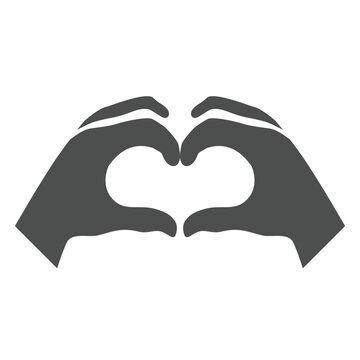 Hands making or formatting heart symbol