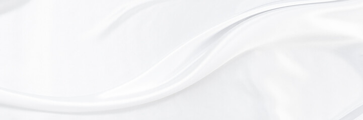 White gray satin texture that is white silver fabric silk panorama background with beautiful soft blur pattern natural.