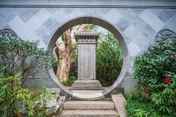 Chinese city park wall Round gate and stone tablet