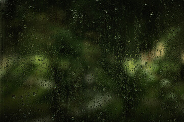 Fototapeta na wymiar Rain drops on window on the rainy day