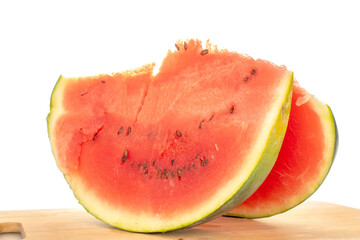 Two slices of juicy watermelon on a wooden kitchen board, macro, isolated on white background.