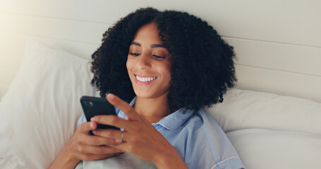 Phone, happy woman and bed of a young female texting on a social media app in the morning. Wifi,...