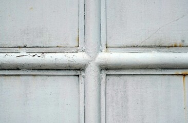 A white metal door with metal frame, detail of old door, for texture and background design