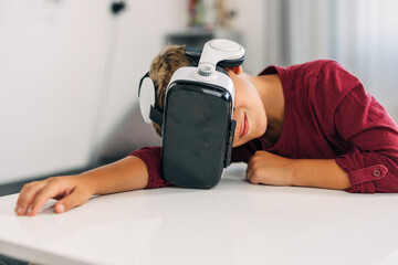 A young Caucasian boy enjoys virtual reality world.