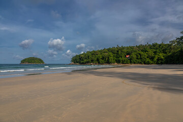 Beautiful beach on a summer day. Blue sky. Sunny day. Yellow sand on the beach.