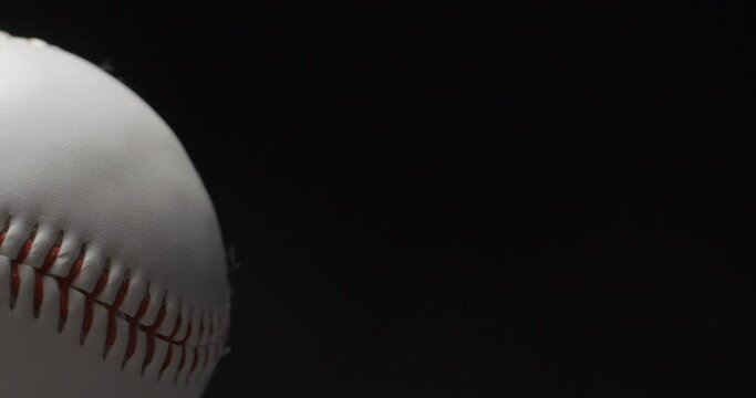 Baseball ball close up rotating in studio