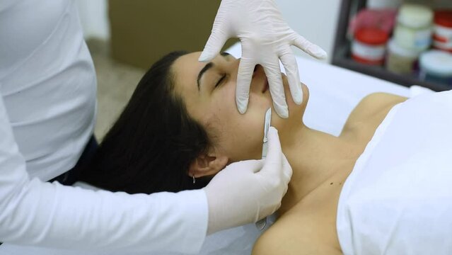 beauty treatment and cosmetology in an aesthetic center with the dermaplaning technique for the health and aesthetics of the skin