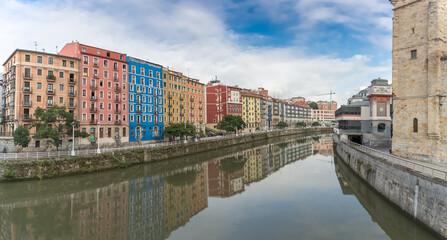 Panoramic exterior view at the Bilbao downtown city, Nervión river and river banks and iconic buildings