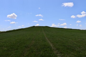 The green grass hill in the countryside.