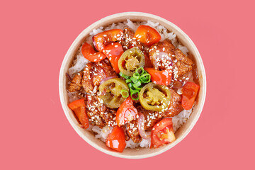 rice with tomatoes, peppers and fried meat and hapanero peppers on a red background, studio shot