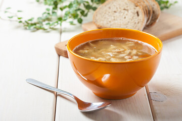 Traditional polish tripe soup with vegetables.