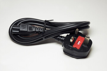 Fototapeta premium power lead cord. UK plug with built-in fuse 3A and cloverleaf connector, tied with nylon zip ties