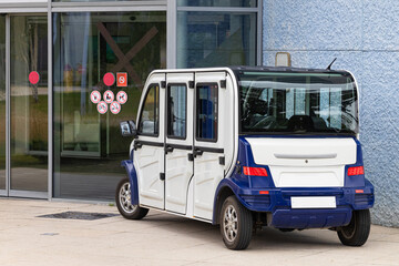 Fototapeta premium walking electric car in the parking lot.