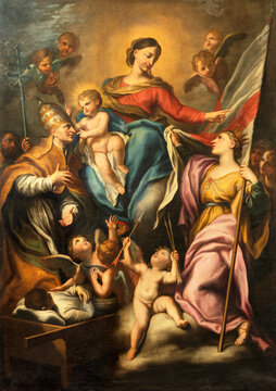 GENOVA, ITALY - MARCH 6, 2023: The painting of Madonna with the sant Gregory the Great and St. Orsola  in church Basilica della Santissima Annunziata del Vastato by Anton Maria Piola (1654 - 1715).