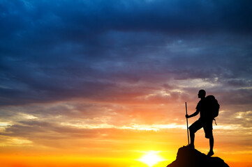 Man on top of mountain.