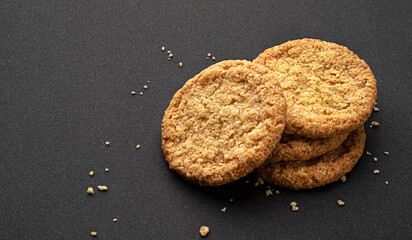Oatmeal cookies on black background, full depth of field
