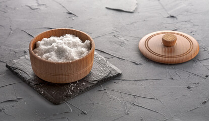 Rock salt in a wooden bowl. For designers.