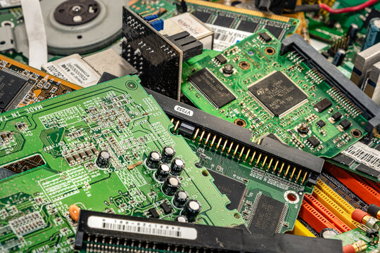 Opole, Poland - 08.07.2023 - electronic waste, used PCB (printed circuit board) prepared for recycling. Concept photo of eco, sorting, and disposal of electronics.