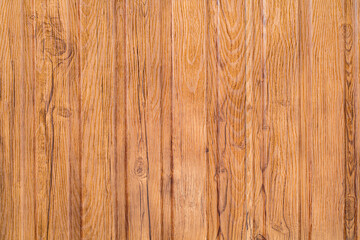 Surface made of wooden boards processed arranged vertically, close-up, uniform texture background