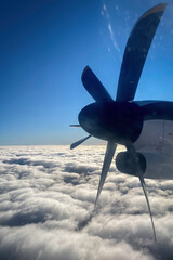 Naklejka na ściany i meble Propeller of an airplane standing still above the clouds