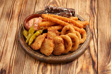 tasty snacks on the wooden background