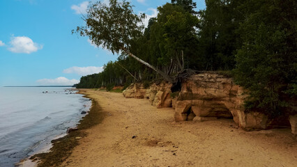 Veczemju Cliffs Red Rocks, Latvia. Red Sandstone Cliff by the Baltic Sea Coast of Vidzeme With...