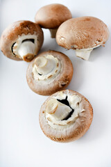 Mushrooms on a white background. Edible mushrooms from the store. Beautiful mushrooms.