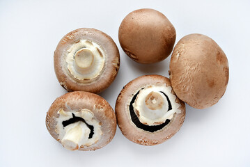 Mushrooms on a white background. Edible mushrooms from the store. Beautiful mushrooms.