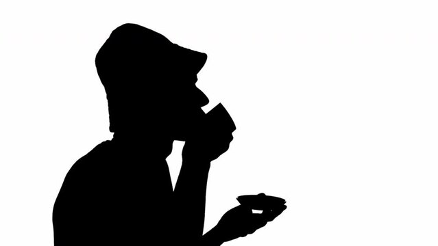 Black silhouette of a man drinking from a cup. black and white mask