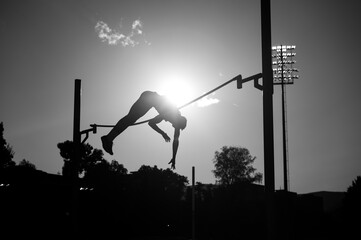 Soaring Heights: Capturing the Elegance of a Pole Vault Silhouette.