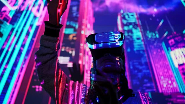 Young black woman getting VR game experience, exploring neon futuristic city