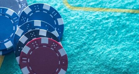 Naklejka premium Stack of casino chips or tokens on a numbered roulette board in payment of a bet in a gambling game of luck and chance