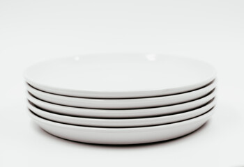 White round plate on white background copy space