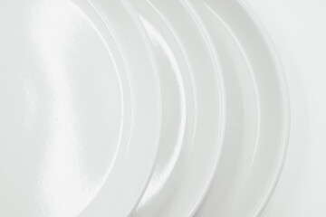 Obraz premium White round plate on white background copy space