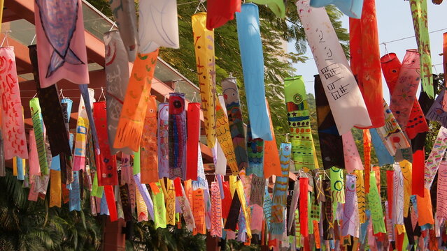 Colorful fish banner flags flying in a Hong Kong fishing village