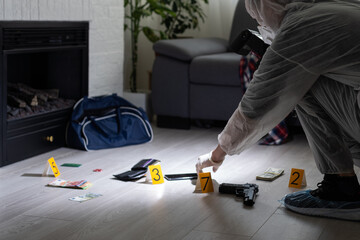 Forensics researcher photographing a blood at a murder scene