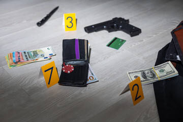 Flat lay composition with evidences and crime scene markers on wooden background