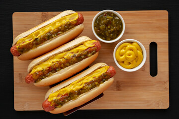 Homemade Gourmet Hot Dogs with Sweet Relish and Mustard, top view. Flat lay, overhead, from above.