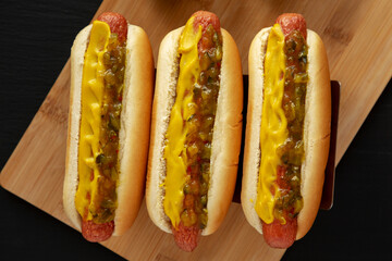 Homemade Gourmet Hot Dogs with Sweet Relish and Mustard, top view. Flat lay, overhead, from above.