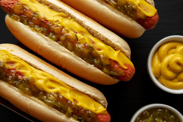 Homemade Gourmet Hot Dogs with Sweet Relish and Mustard, top view. Flat lay, overhead, from above.
