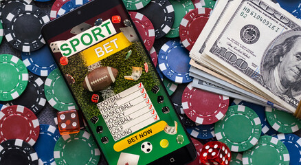 Mobile phone with bets, cards, chips, cubes and money dollars. Concept application for smartphone...