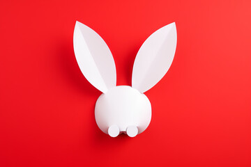 Happy Easter greeting card with white paper cut Easter Bunny Ears isolated on a red