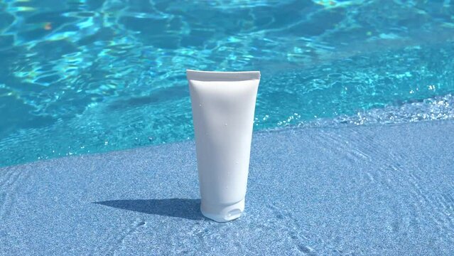 White facial cream tube mockup on blue pool water background. The concept of sunscreen products for the skin, moisturizing and protection from the sun