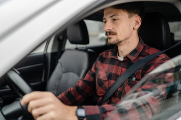 one man drive car adult male sitting on the driver's seat